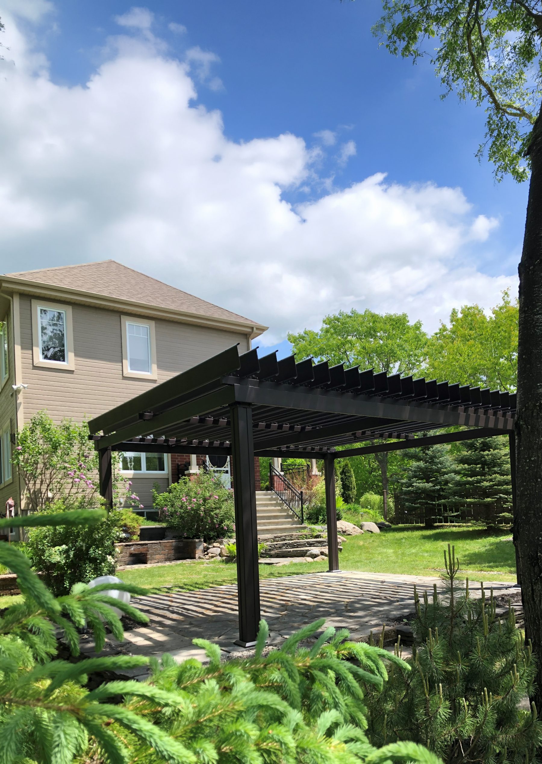 Classic Model installation, landscaped garden, stone