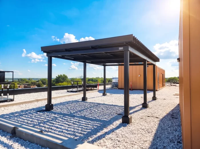 Black pergola on the gravel roof terrace, Les Cours Bellerive in Montréal
