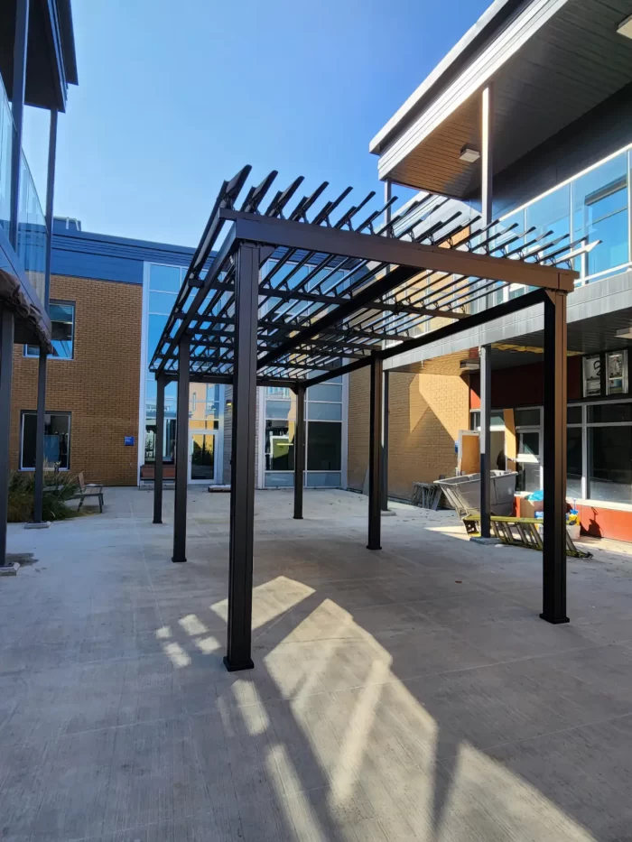 Black pergola over the care home courtyard, CHSLD de Chauffailles in Rivière-du-Loup