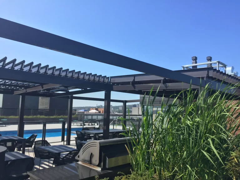 Rooftop terrace with grasses under the dark louvers, Condos Le Nordelec in Montréal