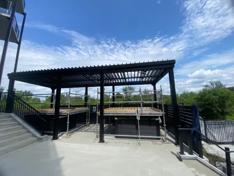 Black pergola over the pool deck, Nox Appartements in Gatineau