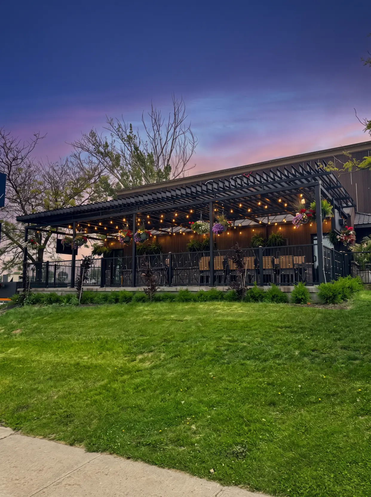 Terrace lit at dusk under the pergola, One Eyed Jack Restaurant and Bar in Kingston