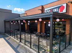 Glass-enclosed terrace under the black pergola, Pacini in Granby