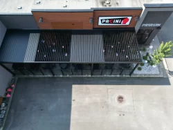 Black louvered roof seen from above over the terrace, Pacini in Granby