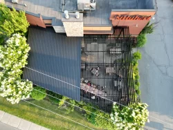 Aerial view of the covered terrace against the restaurant, Les Rôtisseries St-Hubert in Granby