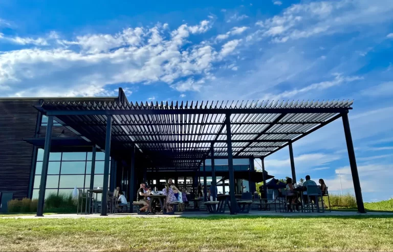 Dark pergola over the estate terrace under a blue sky, Stratus Vineyards in Niagara-on-the-Lake