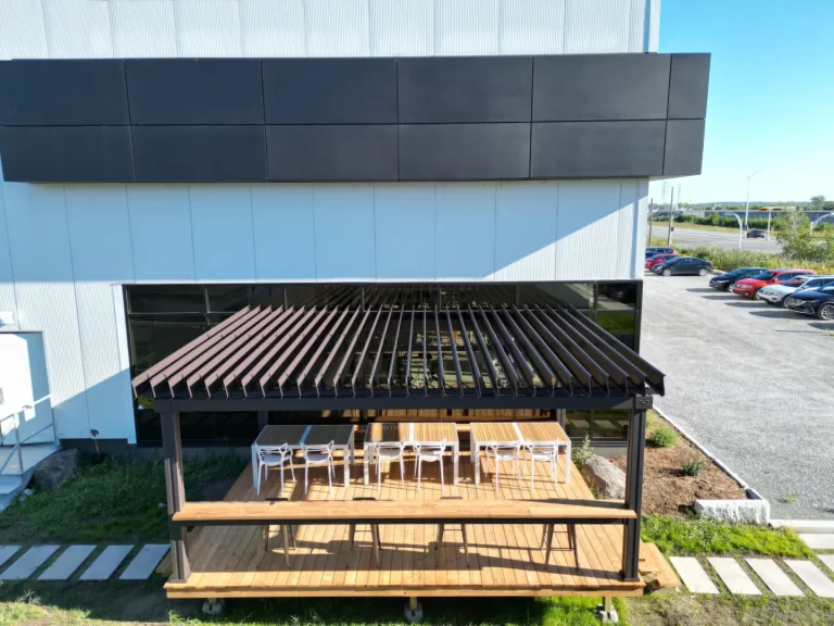 Wooden deck and white chairs under the pergola, SunLouvre Pergolas in Granby