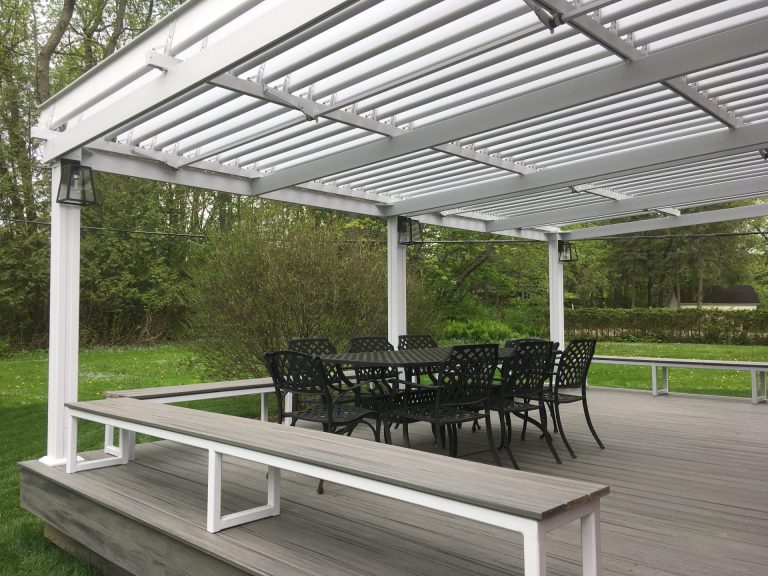 Wooden deck sheltered by a white louvered pergola, Bishop's University in Sherbrooke